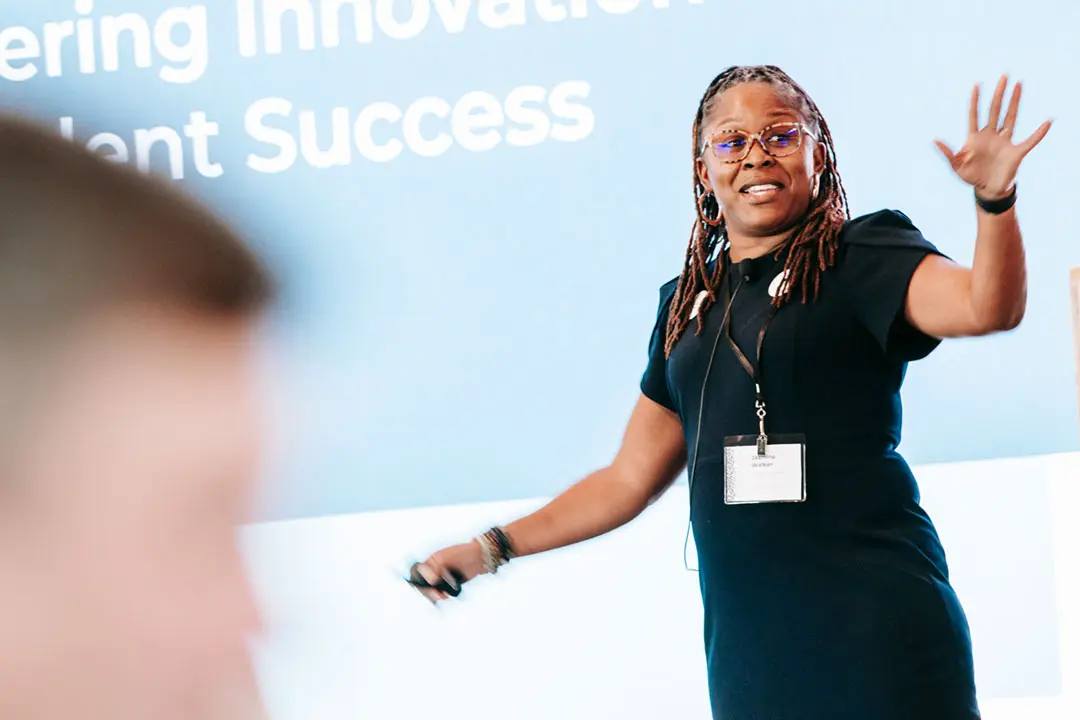 Photo of woman speaking at a conference